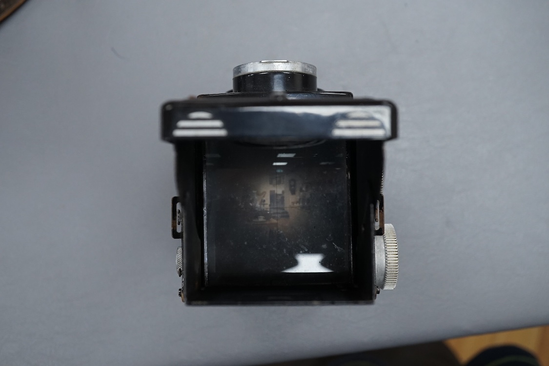 A vintage Rolleicord TLR camera, cased.